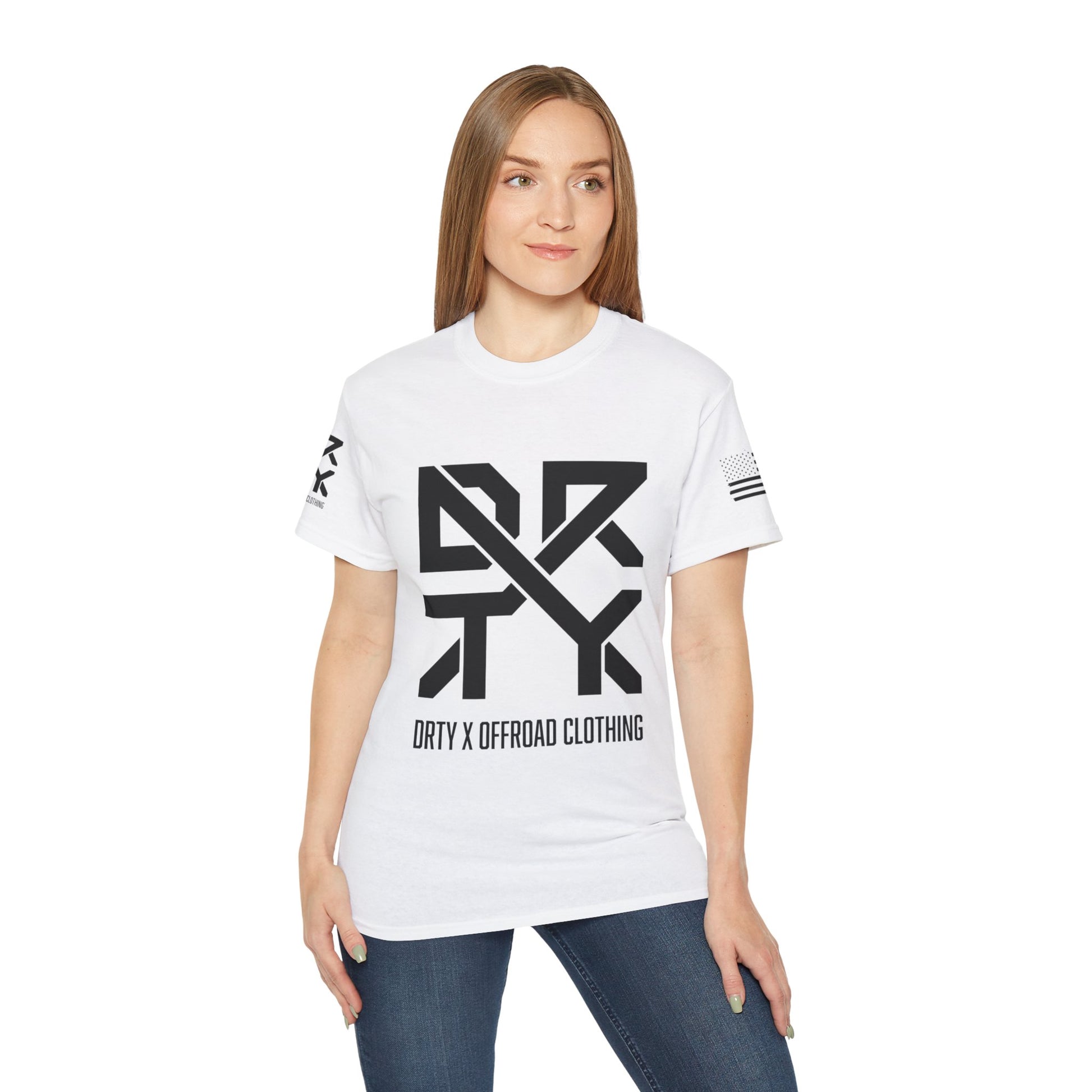 This image showcases the front view of a woman wearing a T-shirt with a DRTY X Logo on the center of the T Shirt and on the right sleeve. The right sleeve has an American flag.