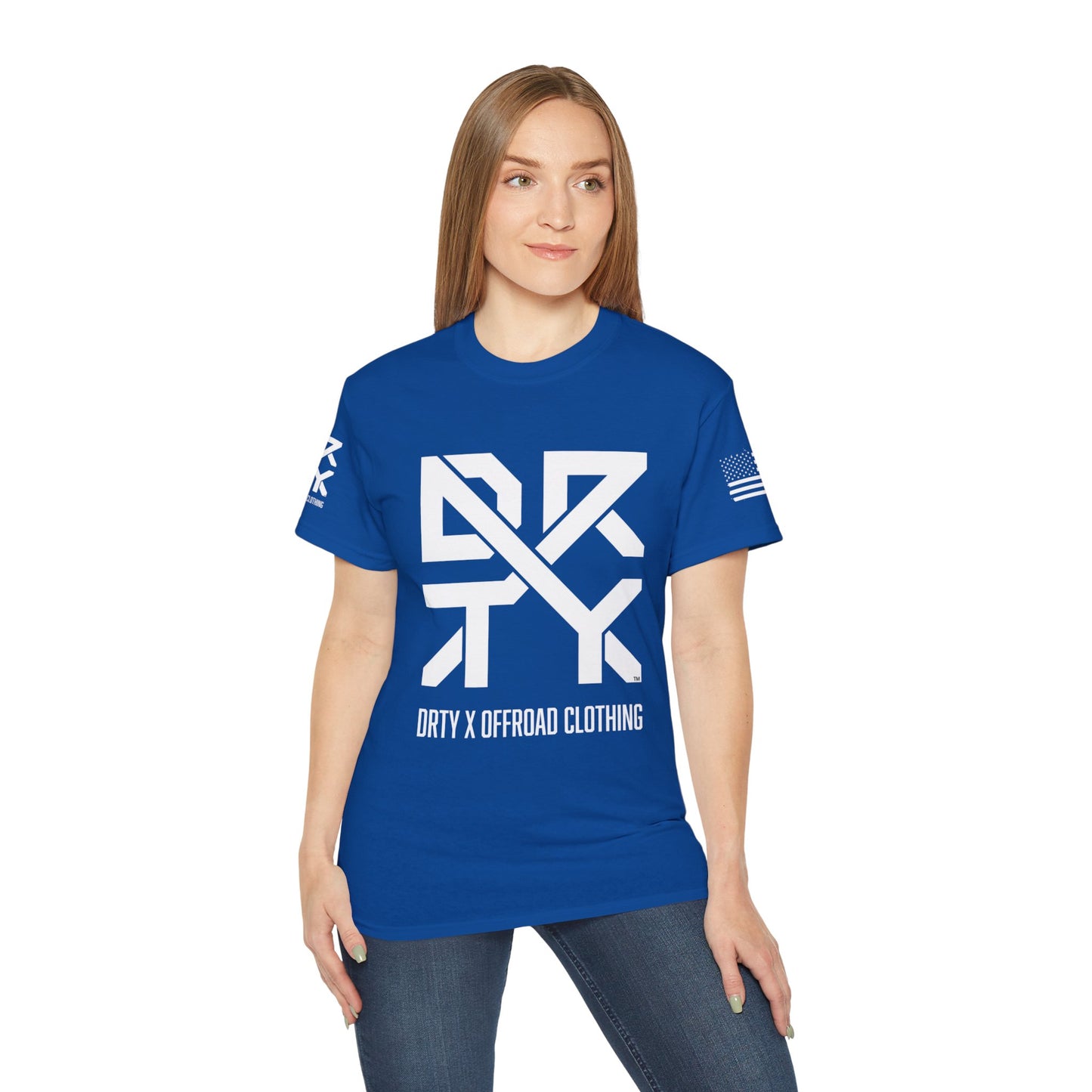 This image showcases the front view of a woman wearing a T-shirt with a DRTY X Logo on the center of the T Shirt and on the right sleeve. The right sleeve has an American flag.