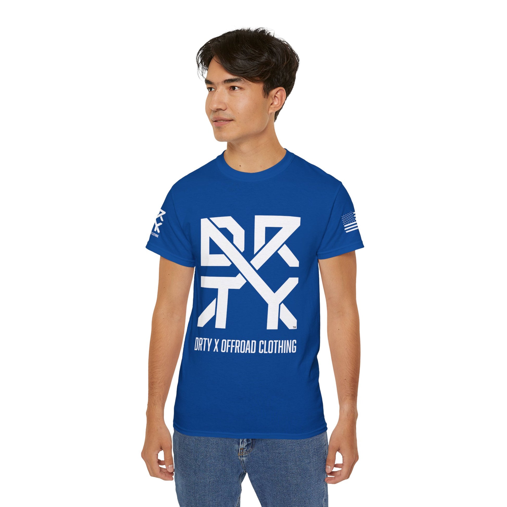 This image showcases the front view of a woman wearing a T-shirt with a DRTY X Logo on the center of the T Shirt and on the right sleeve. The right sleeve has an American flag.