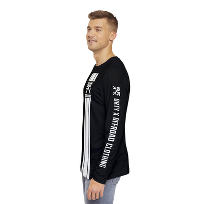 This image showcases the side view of a man wearing a long sleeve shirt with a small DRTY X Logo on the left sleeve  of the shirt with text that says DRTY X Offroad Clothing.
