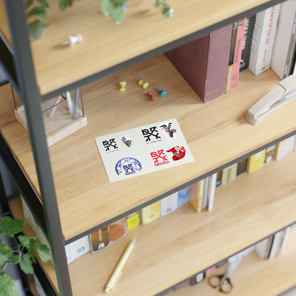 This image shows DRTY X logo and artwork sticker sheet on a bookshelf.
