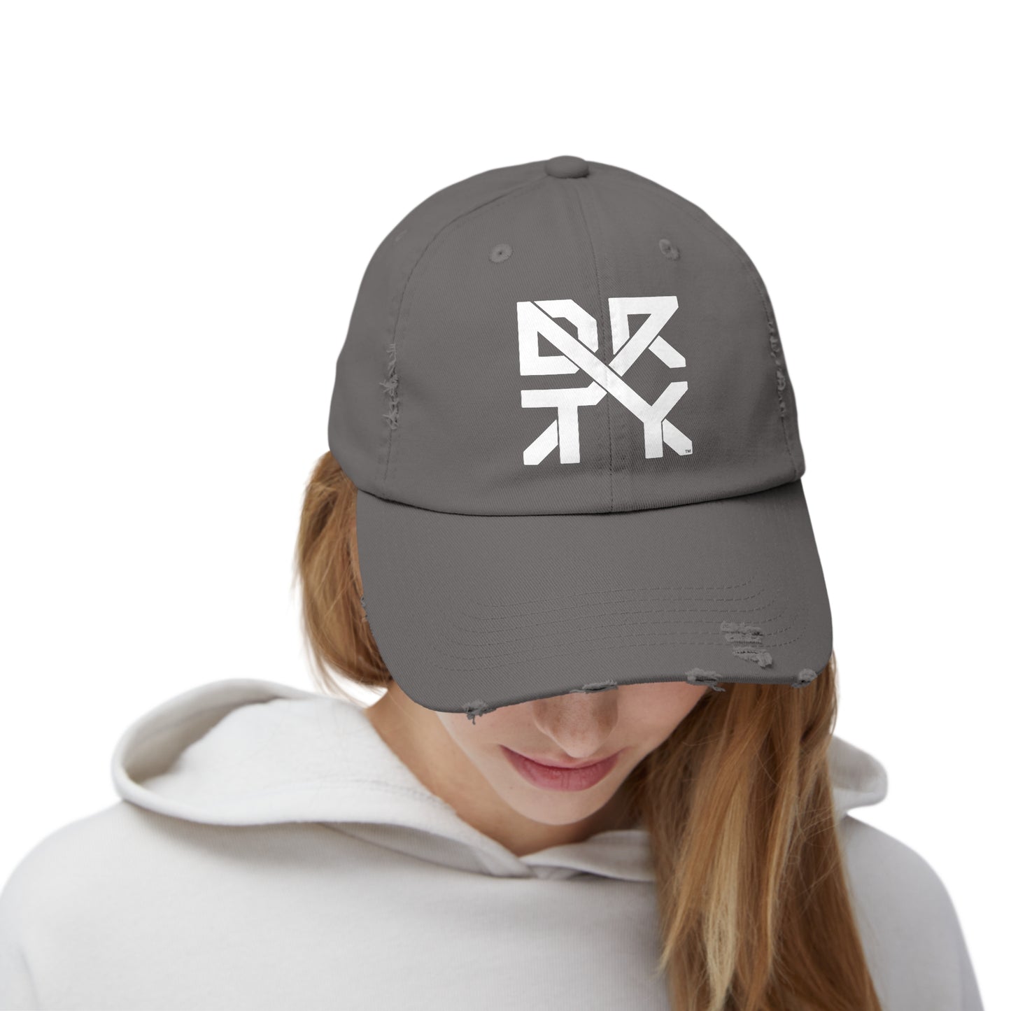 This image showcases the front view of a hat on a woman  with the DRTYX logo in the center of the hat.