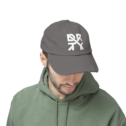 This image showcases the front view of a hat on a man  with the DRTYX logo in the center of the hat.