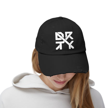 This image showcases the front view of a hat on a woman  with the DRTYX logo in the center of the hat.